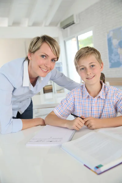 Teacher with pupil in class — Stock Photo, Image