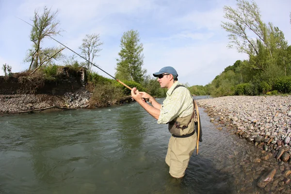 Fisherman with fishing line — Stock Photo, Image