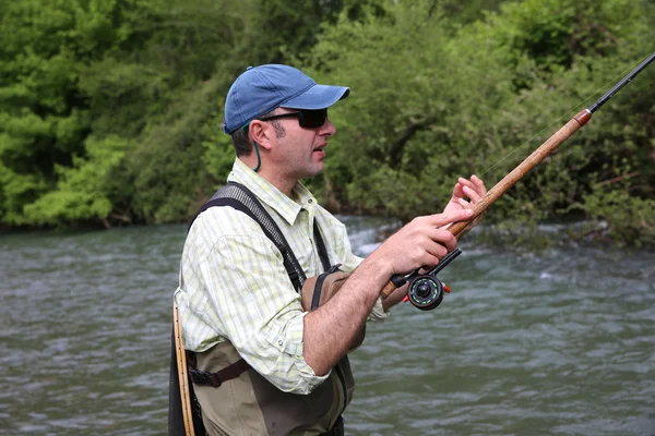 Fisherman with fishing line — Stock Photo, Image