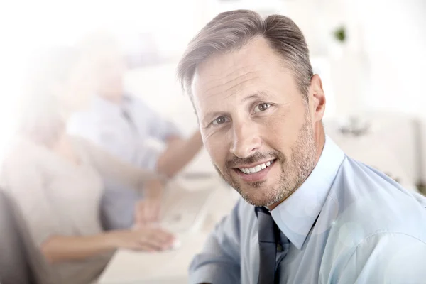 Business manager with employees — Stock Photo, Image