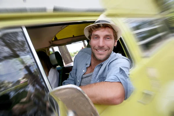 Guy driving  a vintage camper van — Stock Photo, Image