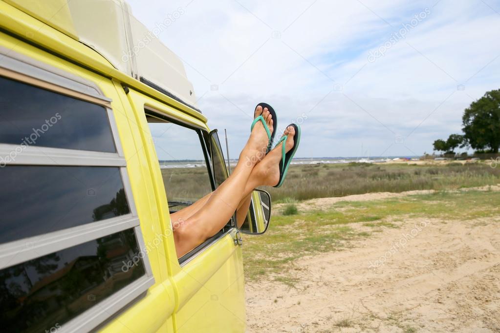woman's feet on camper van window