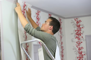 apprentice learning how to put wallpaper clipart