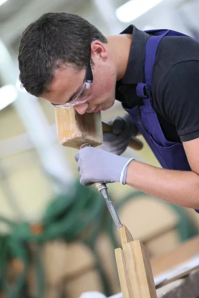 Apprentice in carpentry working — Stock Photo, Image