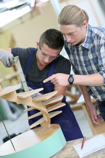 Apprentice working on wood — Stock Photo, Image