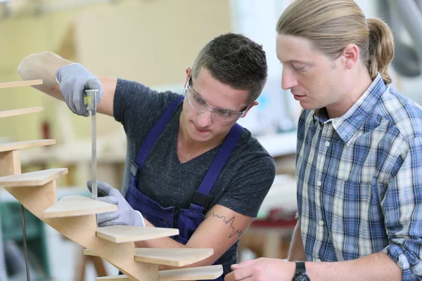 Apprentice working on wood — Stock Photo, Image