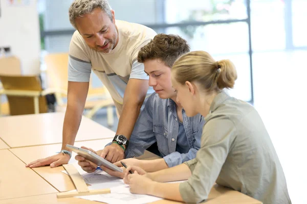 Students working on digital tablet — Stock Photo, Image