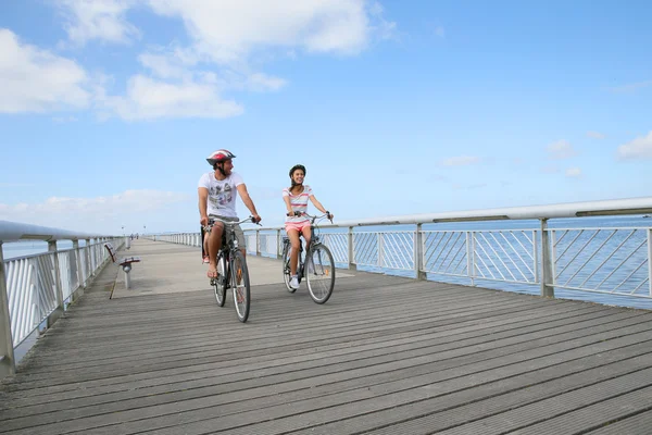 Couple with kid riding bicycles — Stock Photo, Image