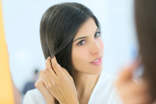 Young woman looking at her skin — Stock Photo, Image
