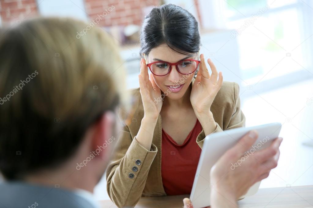 Woman choosing eyeglasses