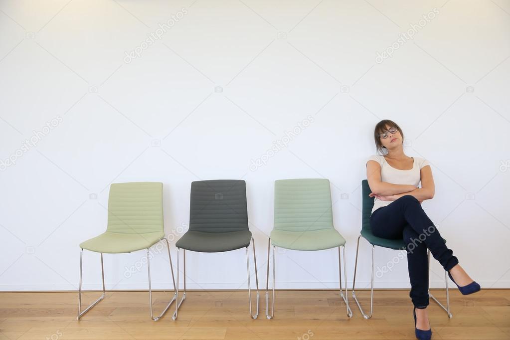  woman in waiting room falling asleep