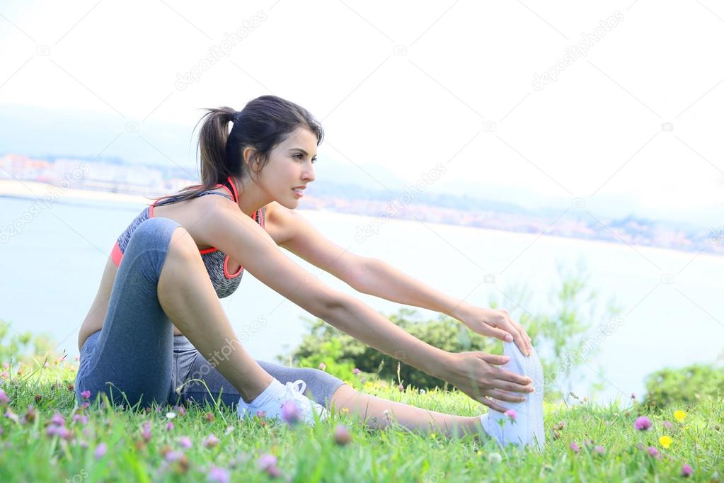 woman doing stretching exercises outside