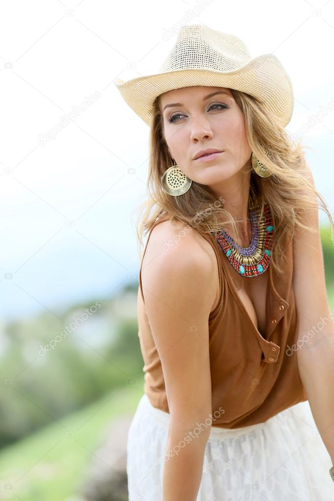 model in  cowgirl style posing