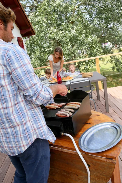 Man cooking grilled meat — Stock Photo, Image