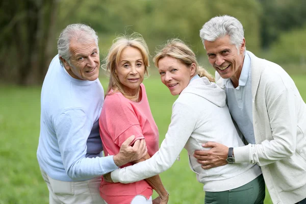Senior people posing outdoors — Stock Photo, Image