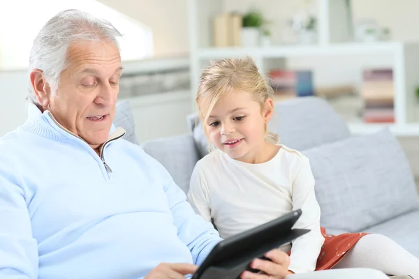 Girl with grandpa playing — Stock Photo, Image