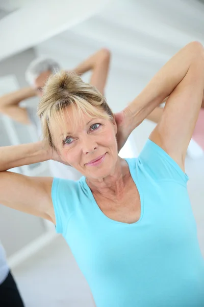 Senior people stretching out — Stock Photo, Image