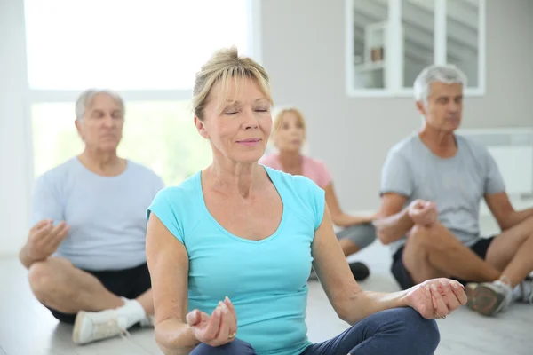 People doing yoga exercises — Stock Photo, Image