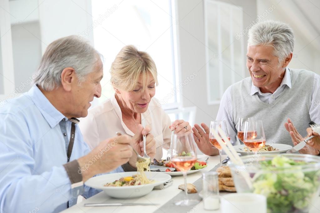 senior people having lunch