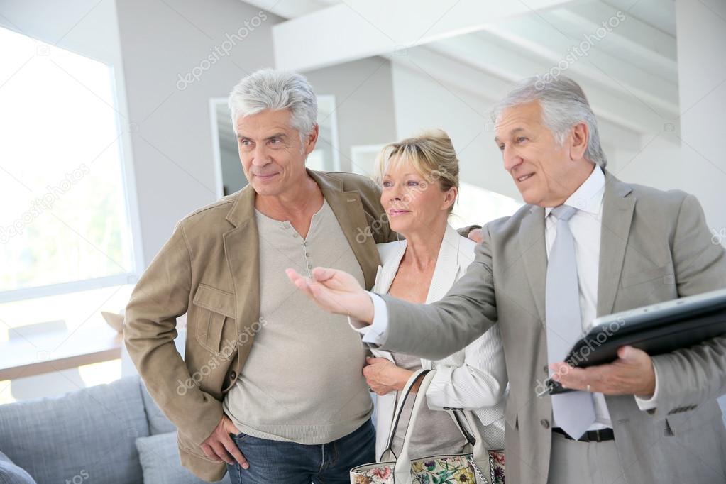 real-estate agent visiting house for sale