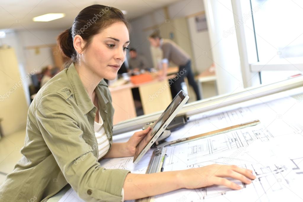 architect working on drawing table