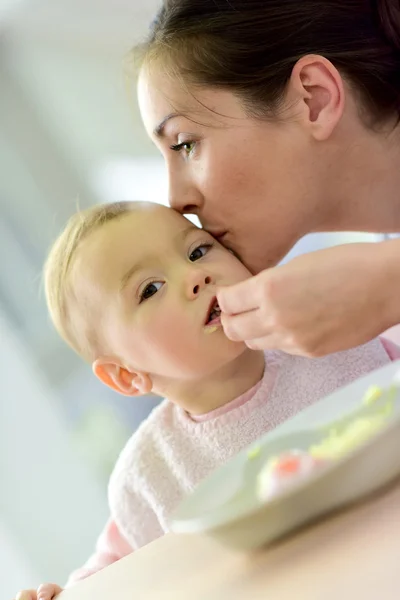 Baby girl eating lunch — Stock Photo, Image