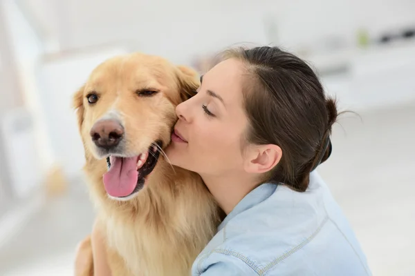 woman petting her dog