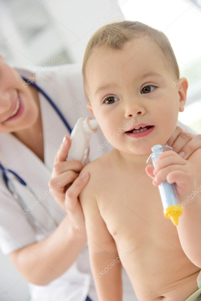 Pediatrician taking  temperature