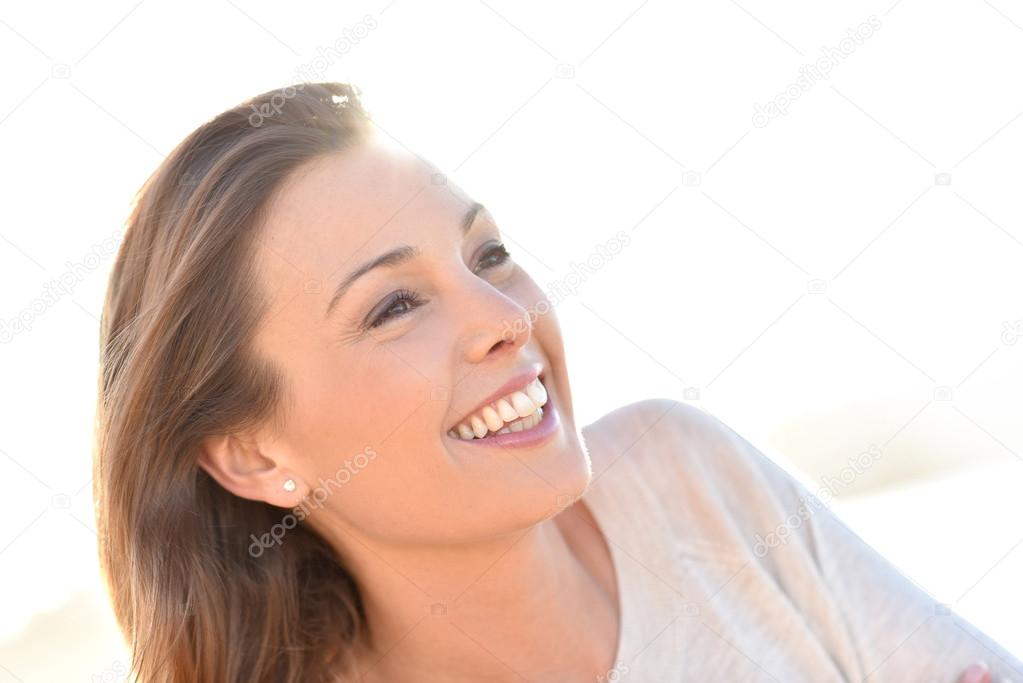 cheerful natural woman smiling