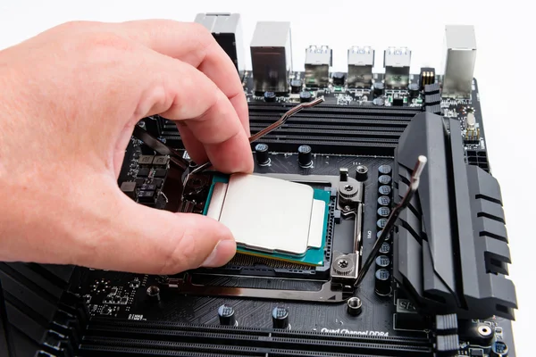 CPU socket and processor, installation on the motherboard. — Stock Photo, Image