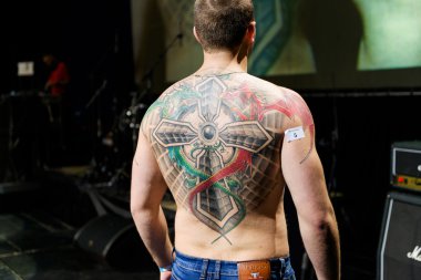 MINSK, BELARUS - SEPTEMBER 19, 2015: People show their tattoos for judging