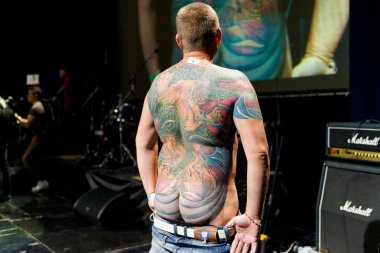 MINSK, BELARUS - SEPTEMBER 19, 2015: People show their tattoos for judging