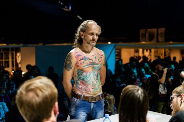 MINSK, BELARUS - SEPTEMBER 19, 2015: People show their tattoos for judging