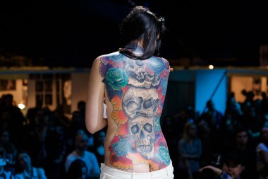 MINSK, BELARUS - SEPTEMBER 19, 2015: People show their tattoos for judging