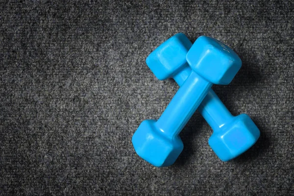 Small dumbbells on floor - fitness concept. — Stock Photo, Image