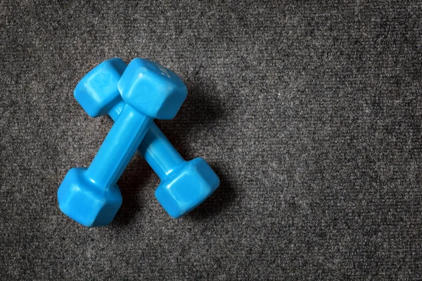 Small dumbbells on floor - fitness concept. — Stock Photo, Image