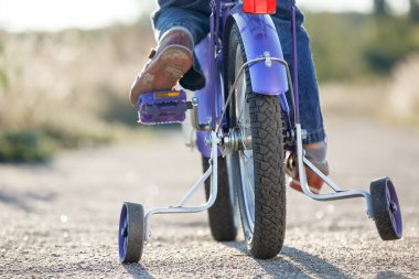 Kids bike with training wheels closeup