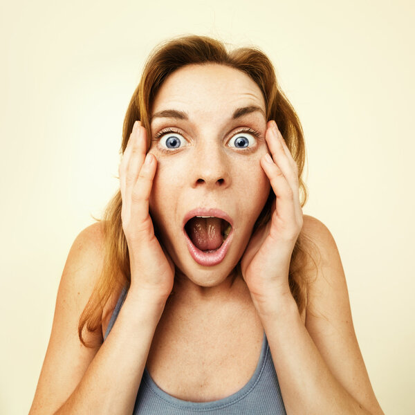 Beautiful young woman surprised.