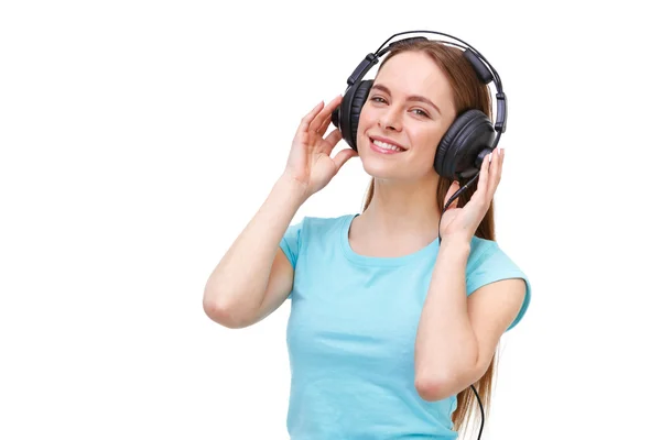 Молода жінка з навушниками слухає музику і танцює - ізо — стокове фото