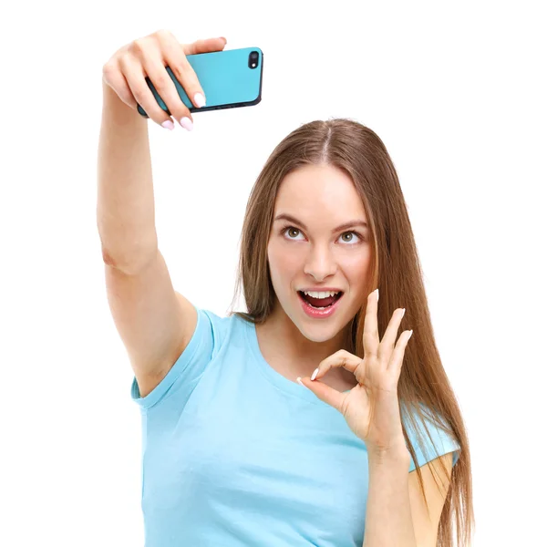 Beautiful young woman taking a picture of herself with her camer — Stock Photo, Image