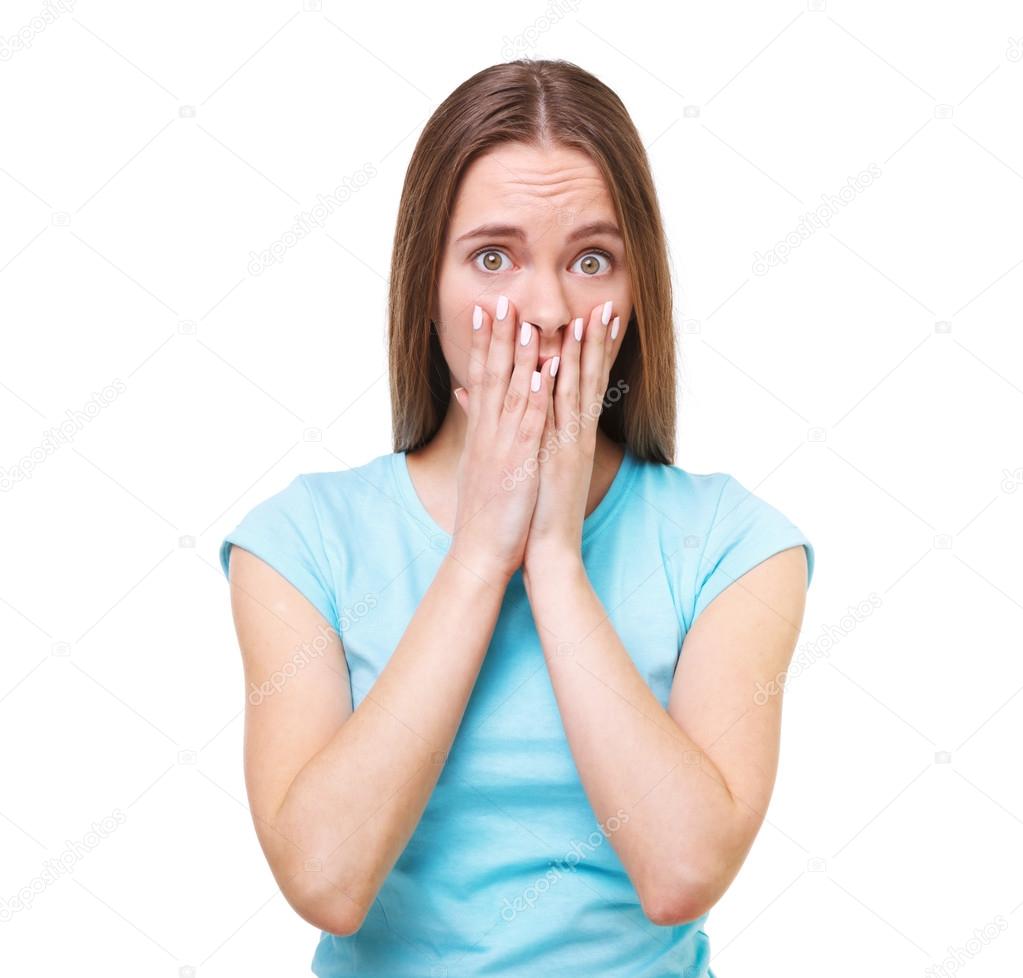 Portrait of young surprised woman isolated on white.