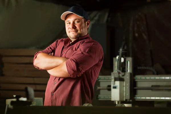 Portrait of happy professional carpenter. Stock Image