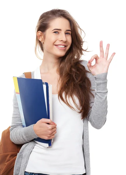 Joven estudiante feliz mostrando ok signo aislado en blanco . —  Fotos de Stock