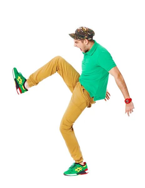 Fullbody portrait of young male kicking in studio isolated on wh — Stock Photo, Image