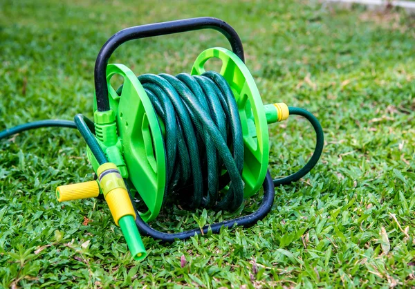 Rubber tube in the garden. — Stock Photo, Image
