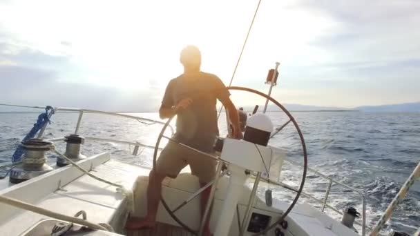 Man navigating sail boat — Stock Video