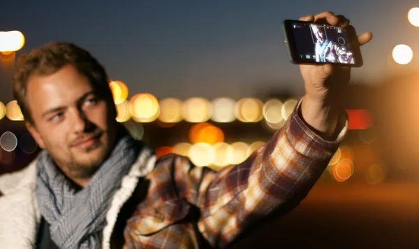 Man use smartphone for a selfie — Stock Photo, Image