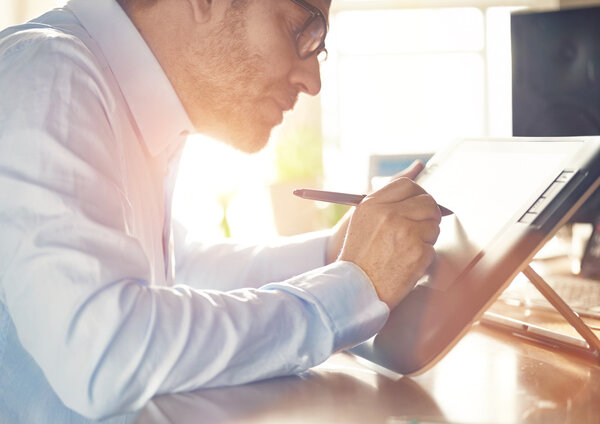 Graphic Designer working with Drawing tablet