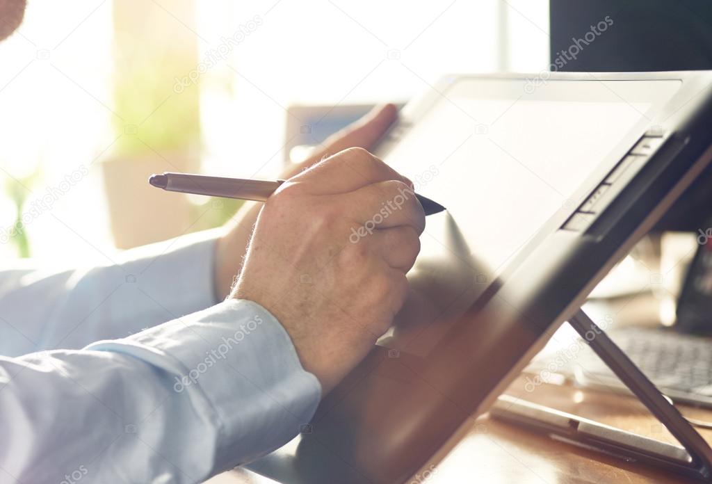 Graphic Designer working with Drawing tablet