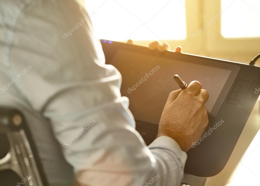 Graphic Designer working with Drawing tablet